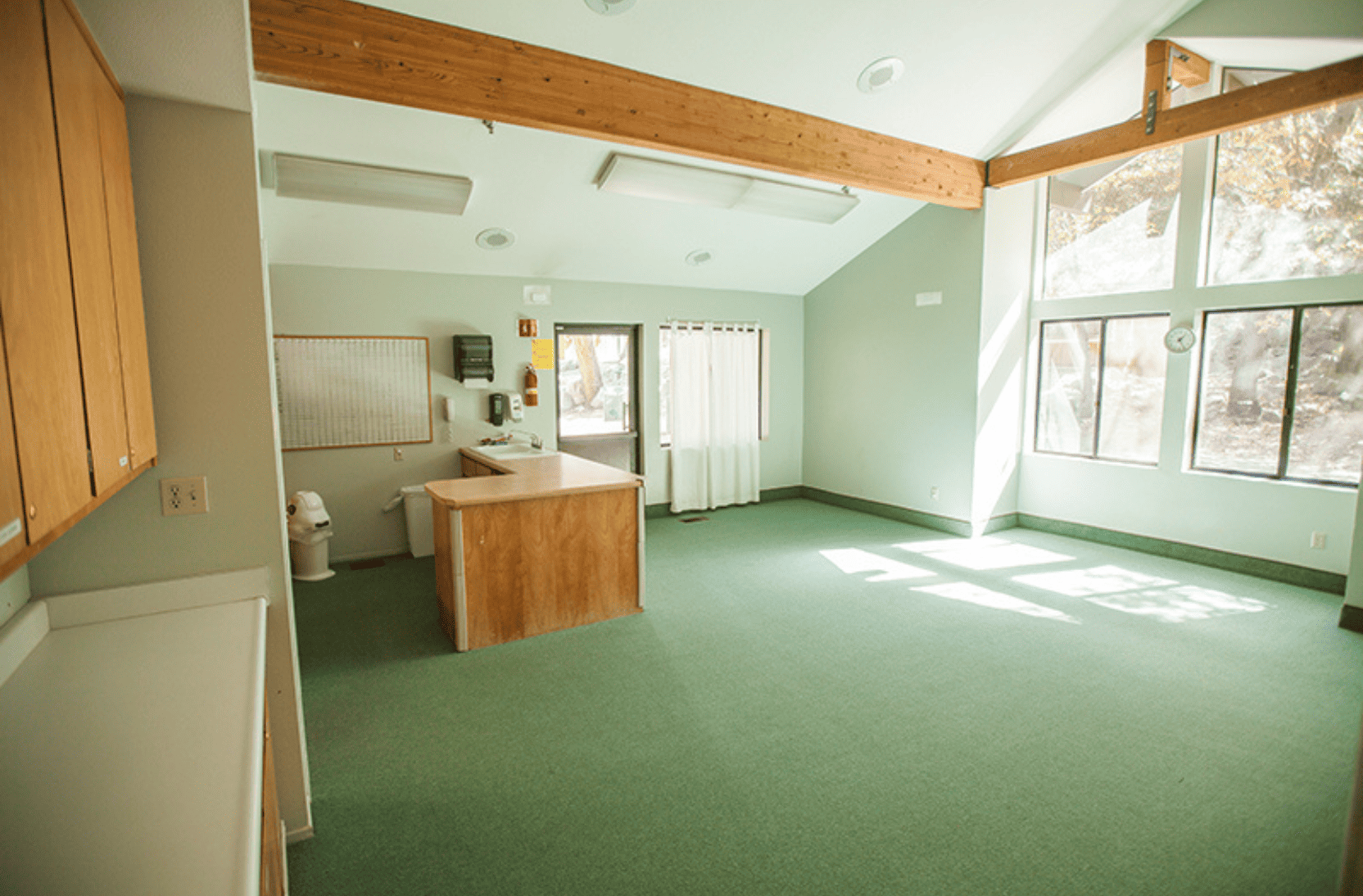 Inside of Chipmunk Corner meeting space with green walls and white walls